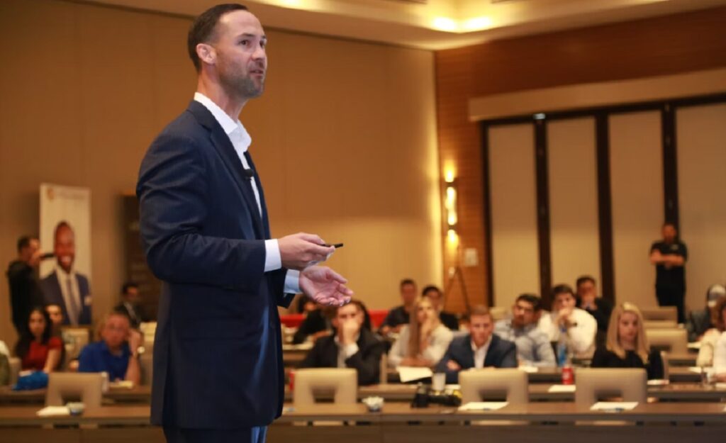 A student presenting to his business school class.