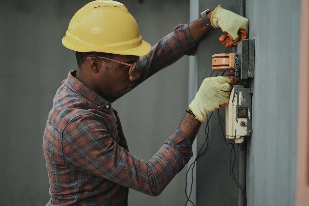 Electrician apprentice at work